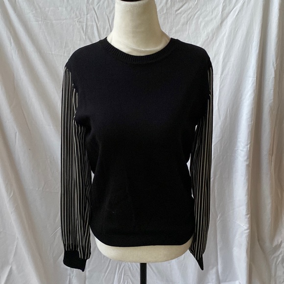 Black sweater with black and white striped sleeves. Great condition. - Picture 1 of 7